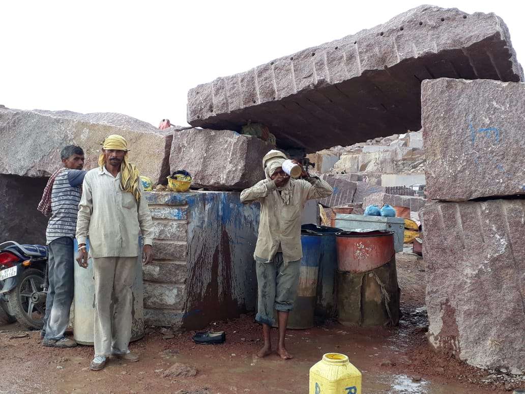 The granite stone quarrying workers the clean water for drinking