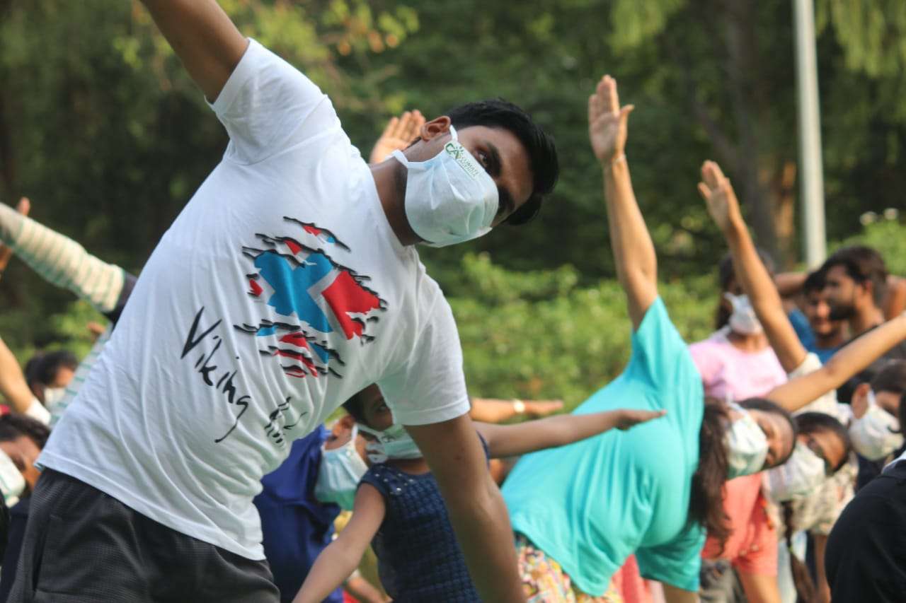 Yoga with mask against air pollution on International Yoga Day