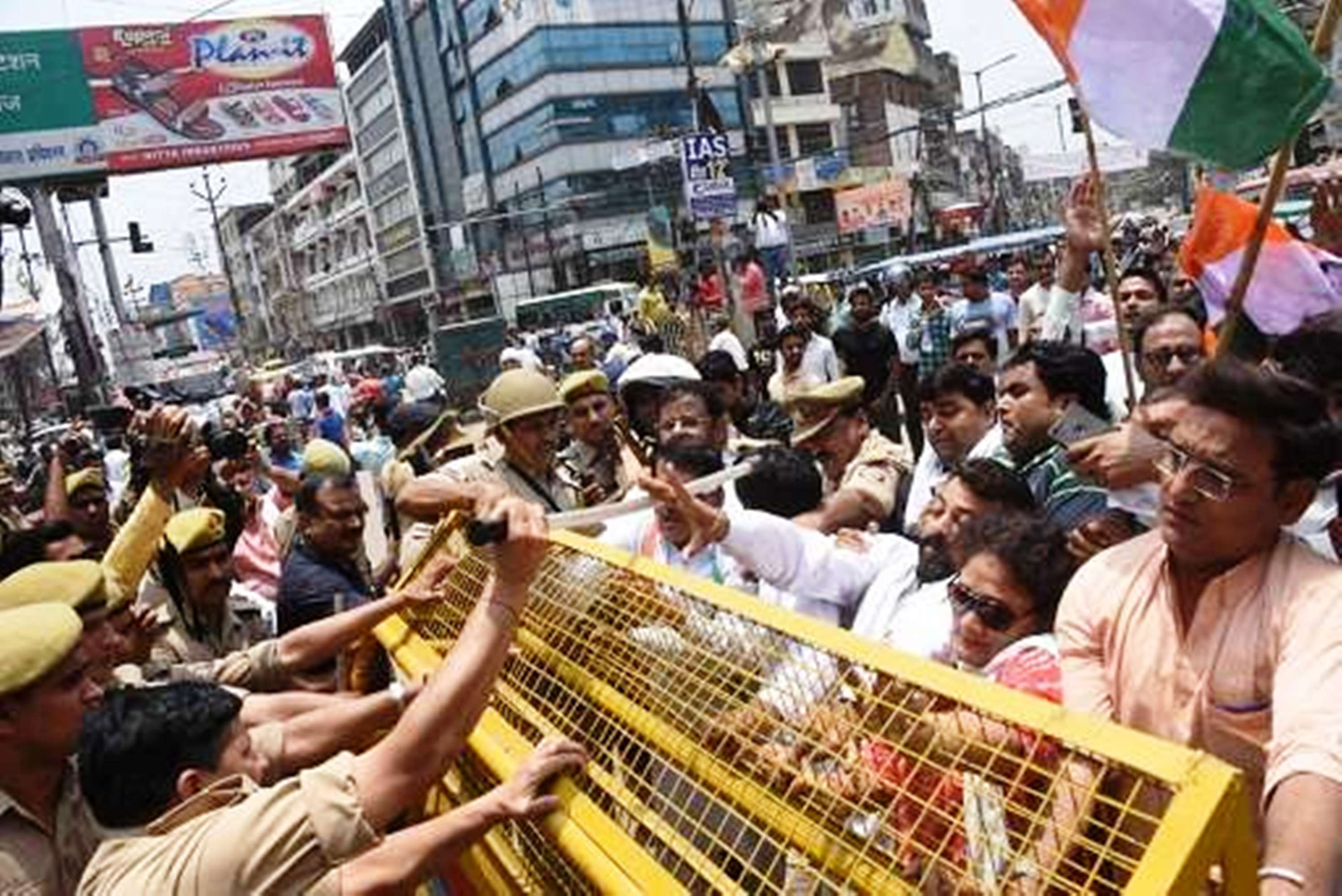 congress workers blow the effigy of up cm yogi adityanath