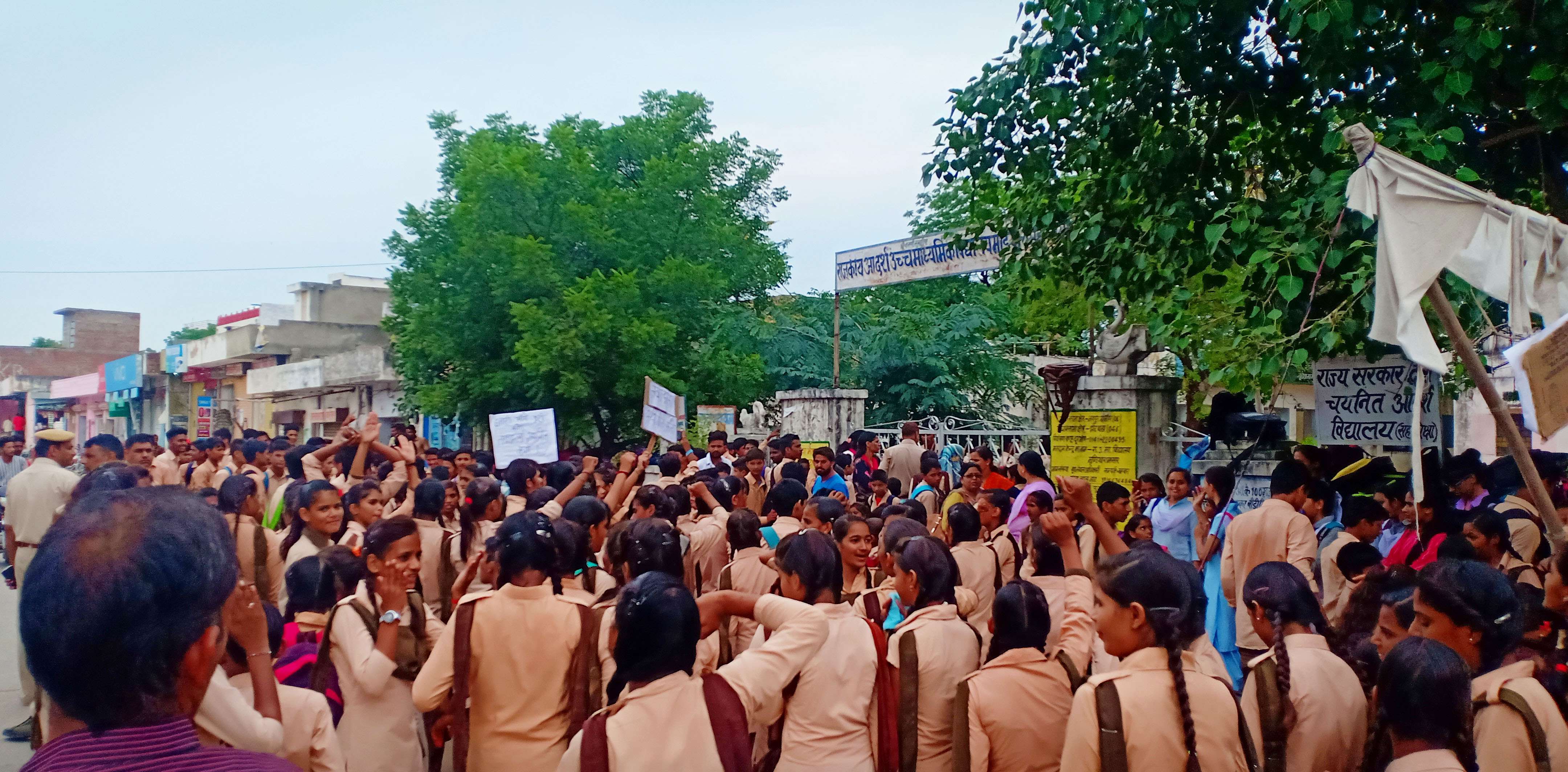 students angry due to transfer : Students lock school