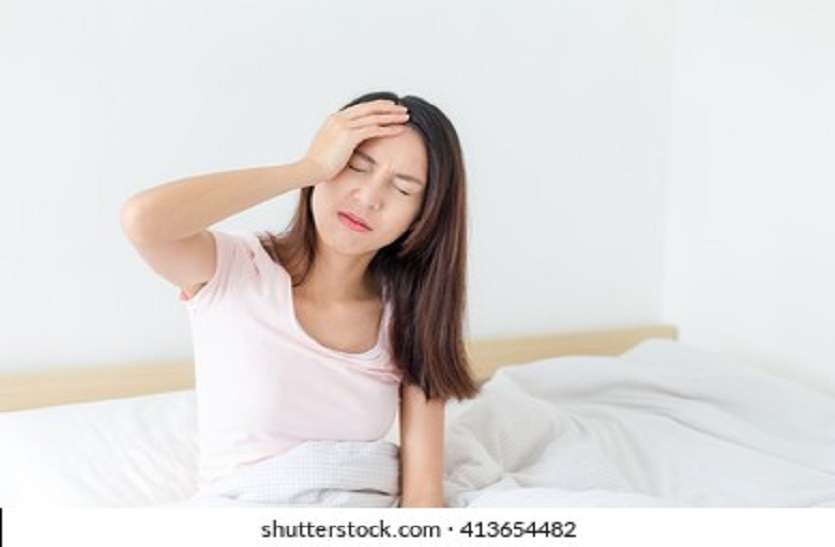sick-woman-on-bed-home-260nw-413654482.jpg