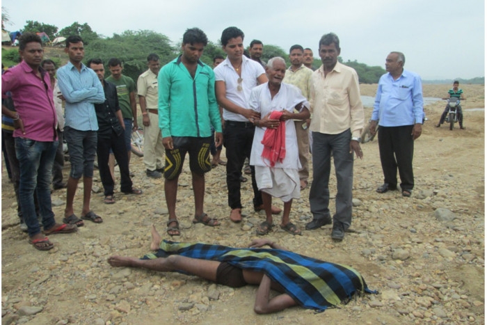 young man immersed in River