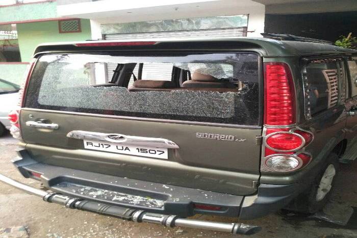Carved glasses of cars parked outside the house