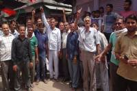 Against GST, hanging locks on clothes shops