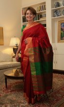 US ambassador MaryKay Carlson shows winning saree