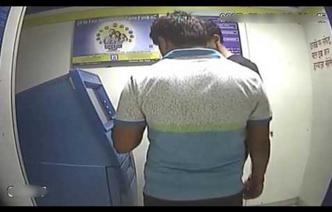 ATM fraud- withdraws money from ATM for help, rbi governor,rbi,RBI Govenor,RBI India,ATM cards hacked,ATM,ATM withdrawal restriction,demonetization,demonetization of Rs 500 Rs 1000,ATM closed,SBI ATM Branches,ATM queue,no money ATM,atm fights,atm news,ATM counters,Narendra Modi. ATM,demonetization effect,SBI ATM,ATM line,ATM Khargone fake currency,atm fraud,atm hacking,atm safety,Bank ATM,ATM withdrawl limit,atm money availability,ATM cash van,atm withdrawal,fraud from ATM,SMS alerts on ATM Frau
