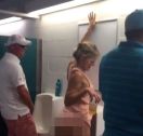  Woman pees in men’s room urinal at football match 
