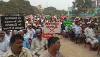 Brass artisan and factory operator protest against GST