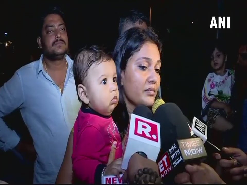 woman feeding his hungry child in the car, traffic police pick the car with woman