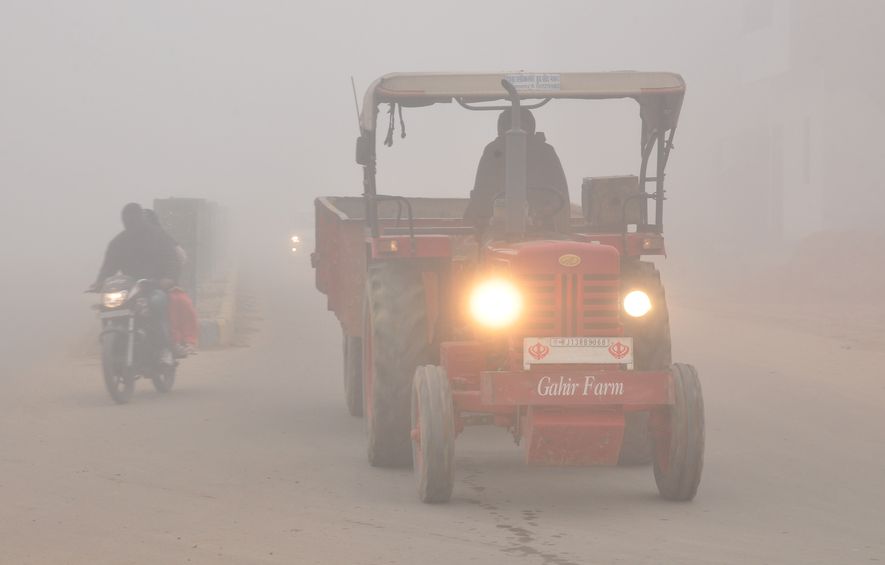 vehicles passing through fog