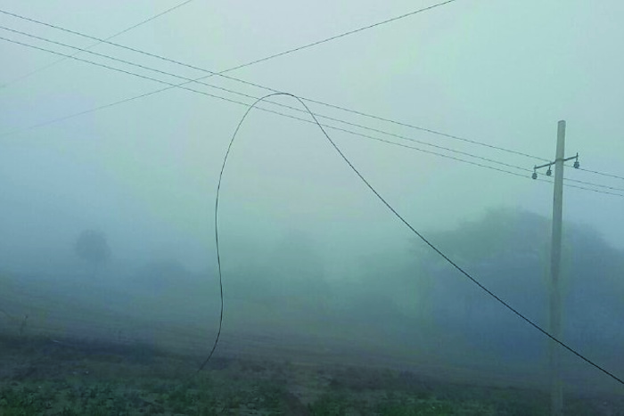 electricity wire broke and fell down on roof