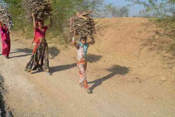 Whole family carrying fuel