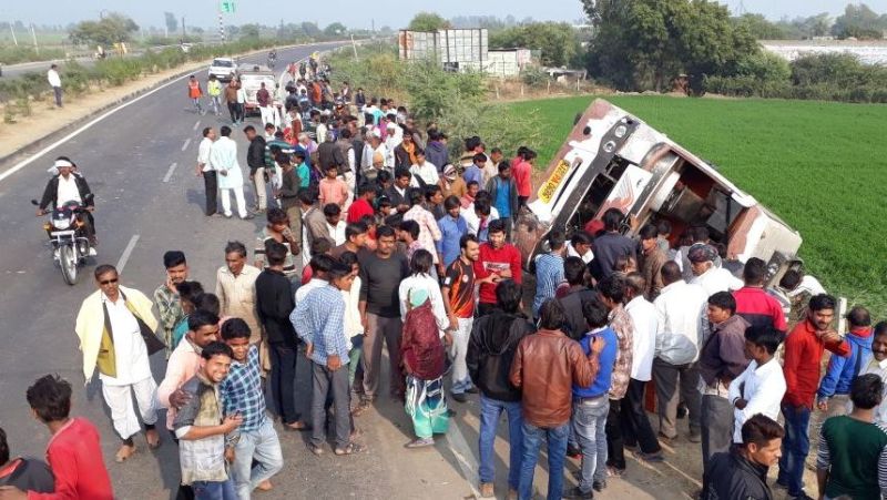 Bus crushes woman on highway, two dozen injured