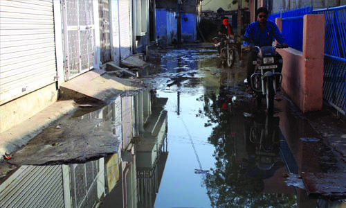 Dirty water spread in the street from sewerage jam in Makrana