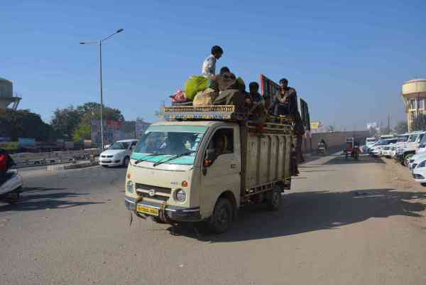 photos of public travelling in overload vehicles and taking risk