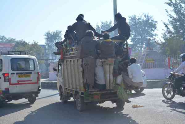photos of public travelling in overload vehicles and taking risk