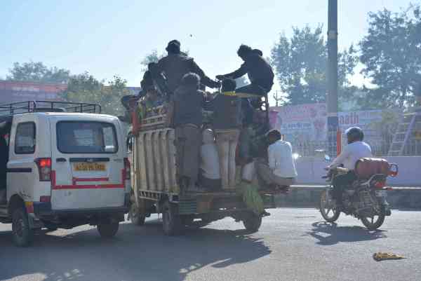 photos of public travelling in overload vehicles and taking risk