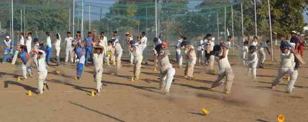 photos of junior cricketers playing cricket  in alwar
