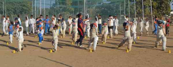 photos of junior cricketers playing cricket  in alwar