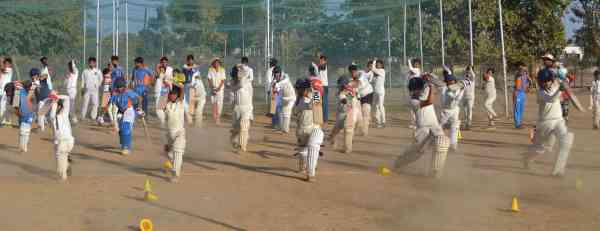 photos of junior cricketers playing cricket  in alwar