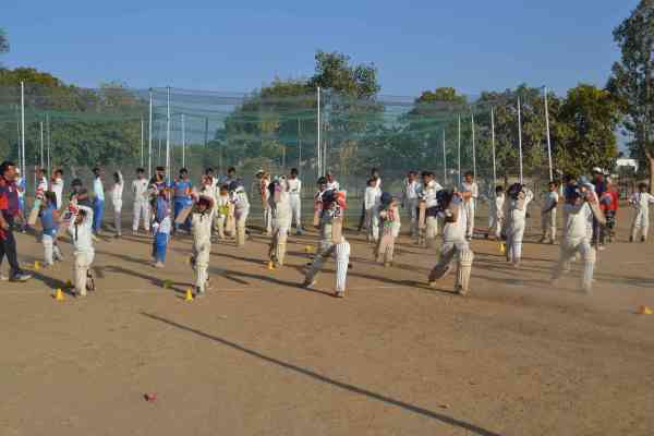 photos of junior cricketers playing cricket  in alwar