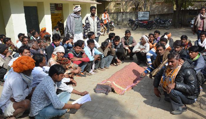 Villagers sitting on dharna with mortal remains believed to be on assu