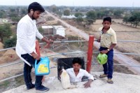 Boys at water tank