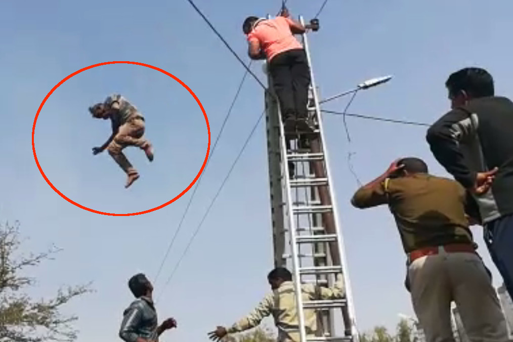a man jump from Electric pole