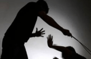 Teacher thrashing student