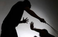 Teacher thrashing student