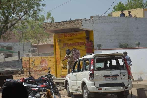 PHOTOS OF POLICE CONSTABLE PROTECTING CIVILIANS