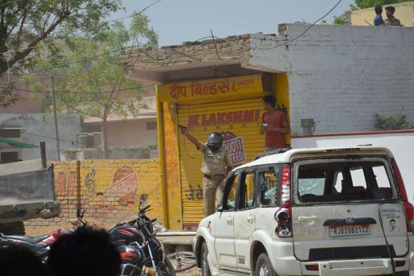 PHOTOS OF POLICE CONSTABLE PROTECTING CIVILIANS