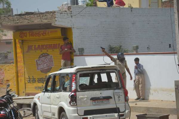 PHOTOS OF POLICE CONSTABLE PROTECTING CIVILIANS