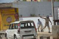 PHOTOS OF POLICE CONSTABLE PROTECTING CIVILIANS