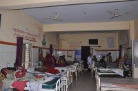 A hospital where fans-coolers are closed, women patient worried