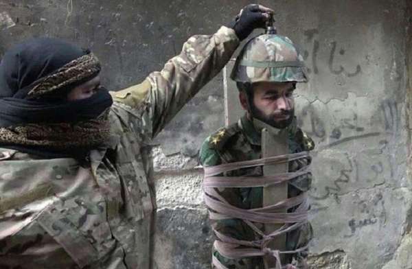 isis news,Isis Syria Iraq,Horrifying images,isis syria,ISIS turn a prisoner into an airborne bomb,fitting explosives in helmet,latest method of execution,