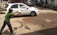 Damaged roads and flying dust bothered with soil