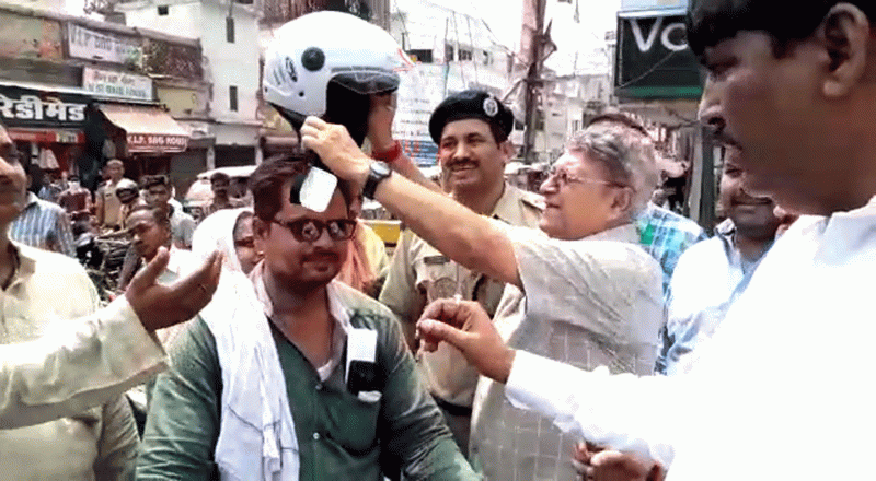 RTO Faizabad distributed free helmets to bike Drivers