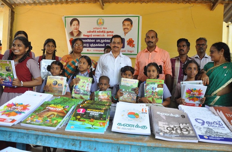 Distribution of notebooks and books to school children
