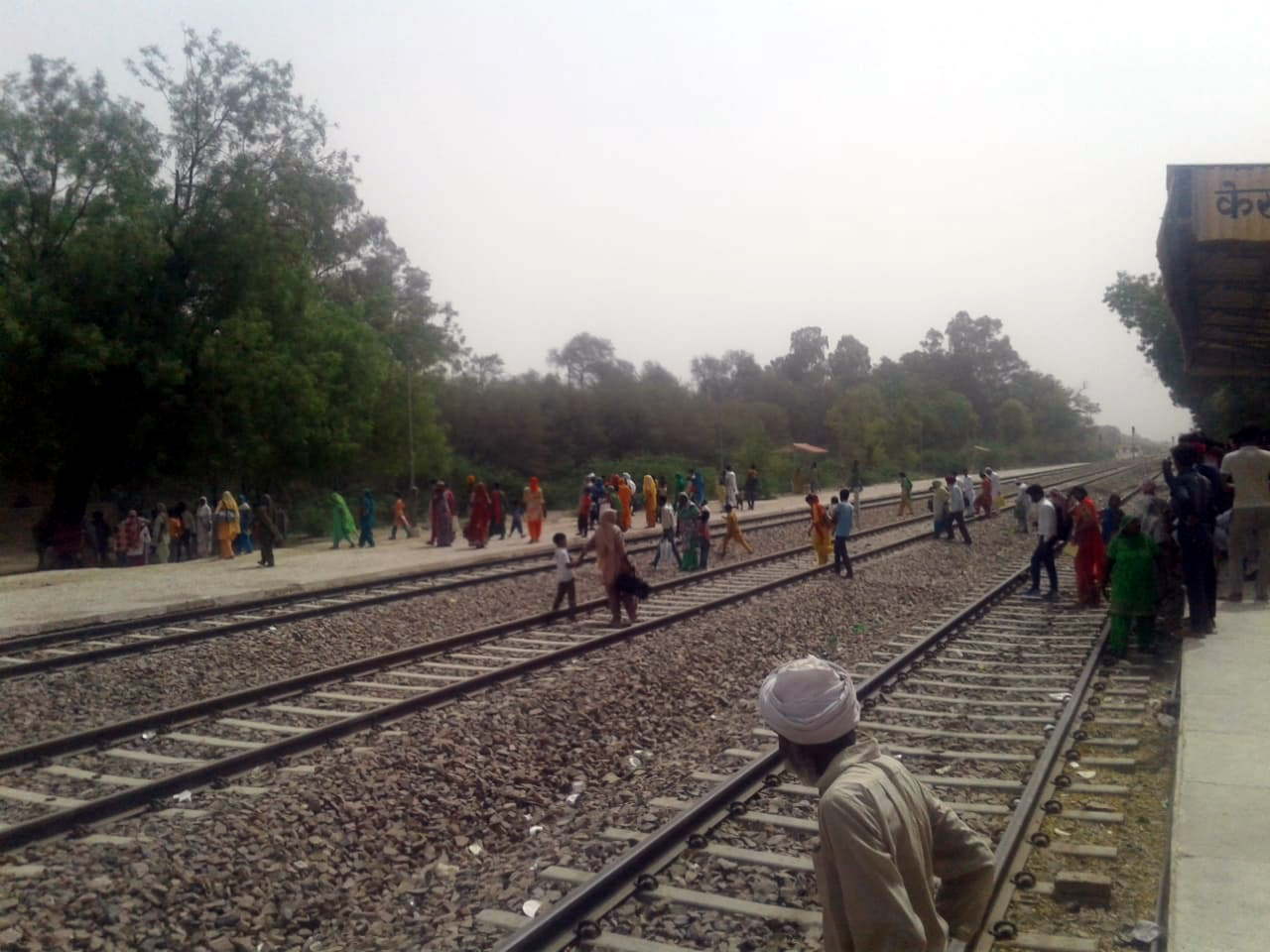 passengers crossing railway line