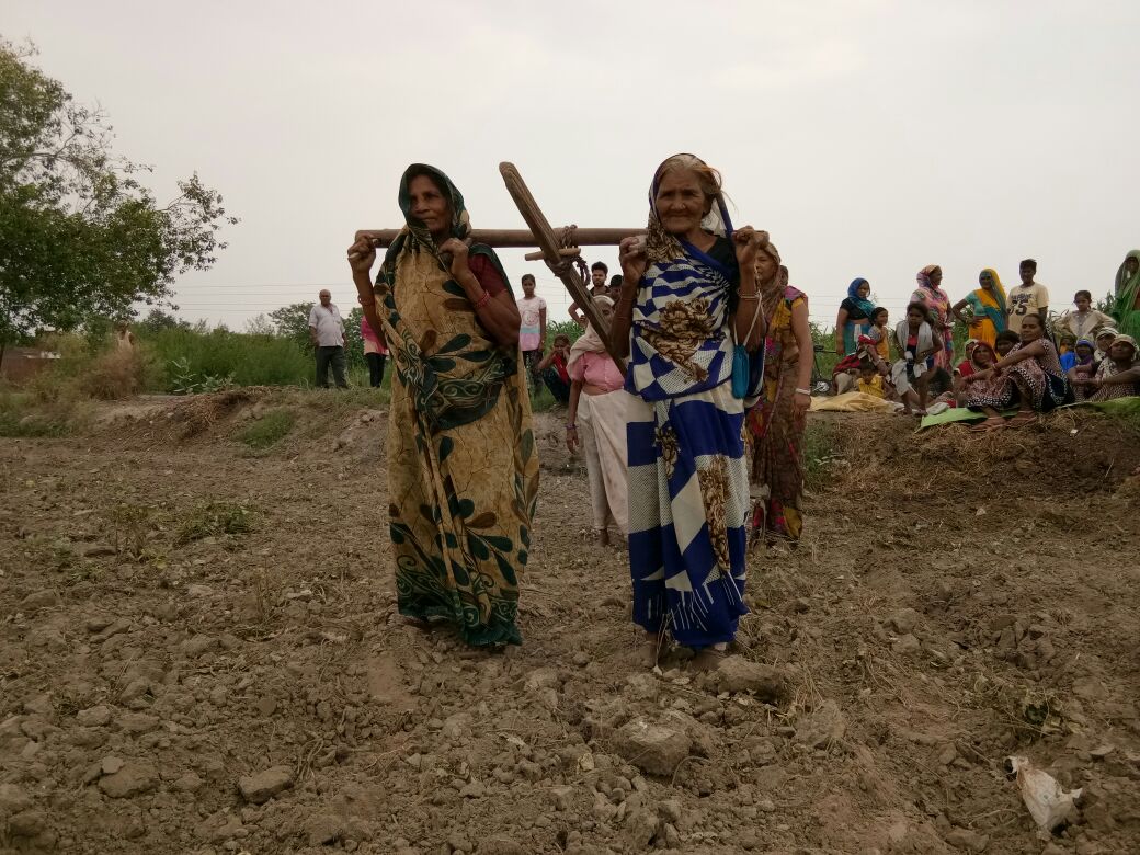 women in a Chobepur in perform pooja on plow while praying for rain