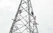 Three young man climbed on electric towers