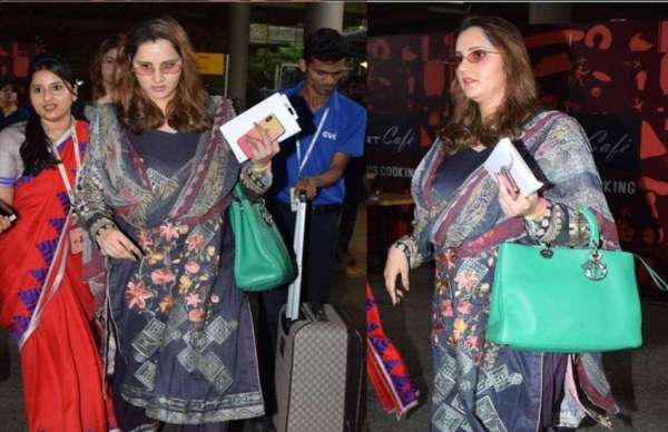 sania mirza spotted at airport with her baby bumps