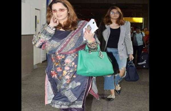 sania mirza spotted at airport with her baby bumps