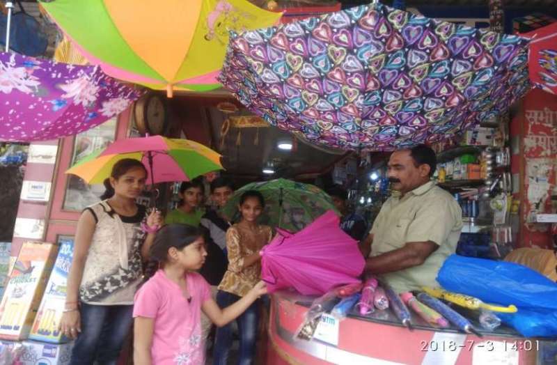 Cartoon on the raincoat, fashion trends on umbrellas