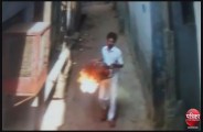 man attack on woman with buring cylender