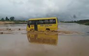 School bus in river