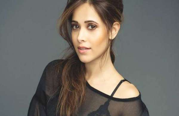nushrat bharucha in black top and ripped jeans latest photos