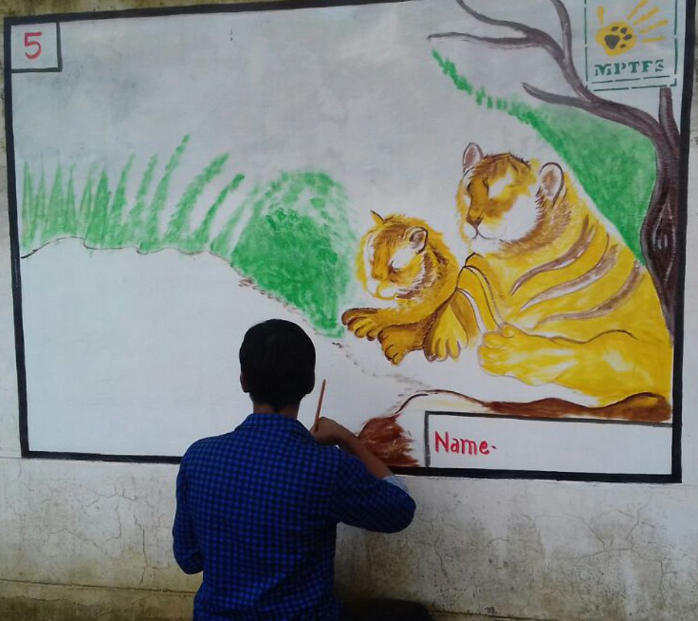 Artwork on walls of international Tiger-Day by artists of panna