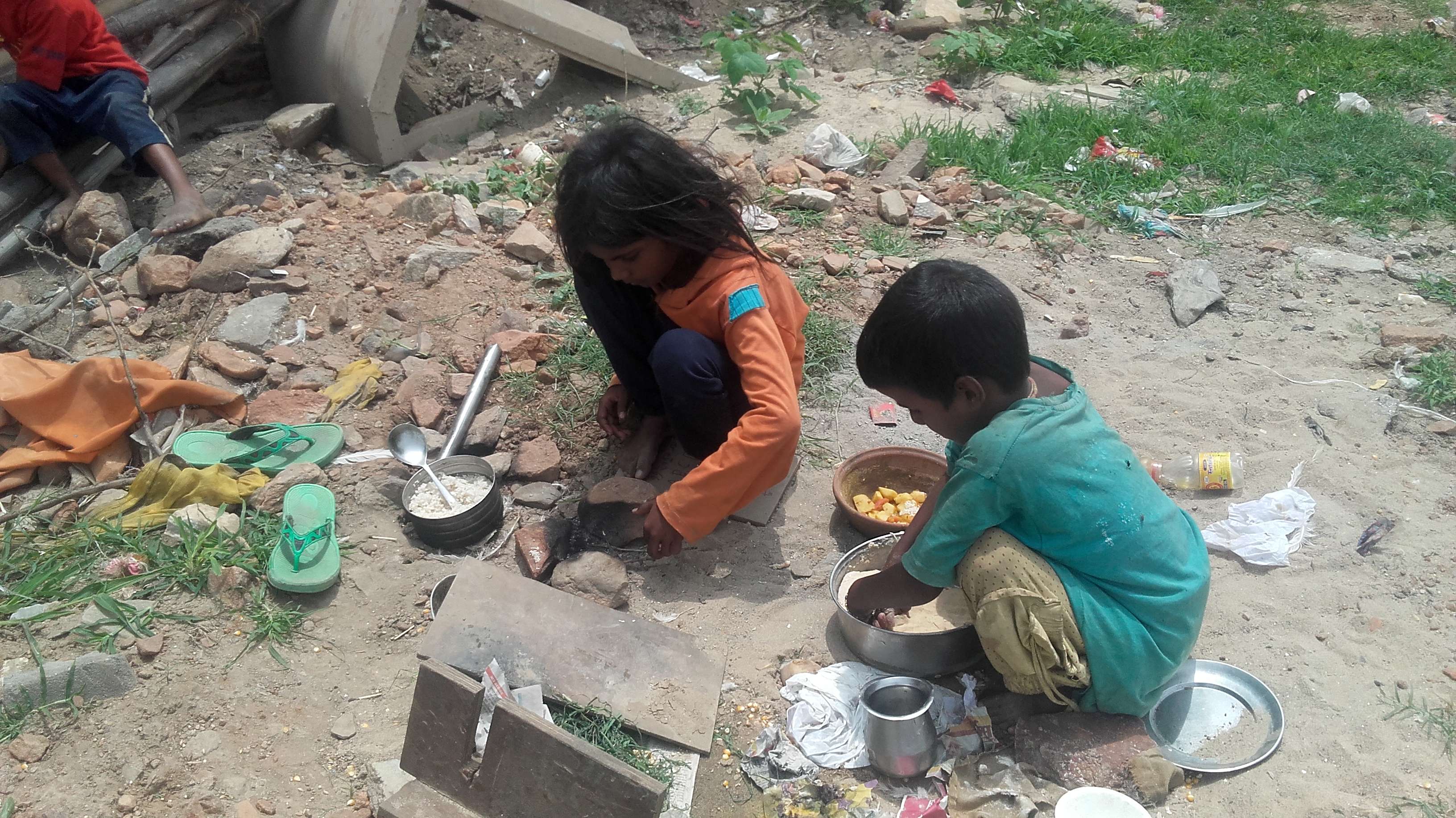 innocent poor girls making mid day meal for family